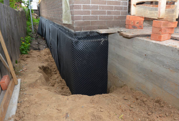 SJ Waterproofing Pros technician performing targeted Emergency Waterproofing assessment in Paragon, IN